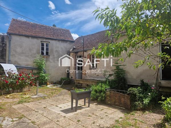Maison double avec cour intérieure. 3 garages.