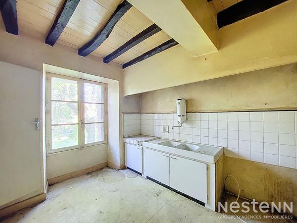 A Vendre Maison en pierre mitoyenne de 165 m² avec jardin proche du centre-ville