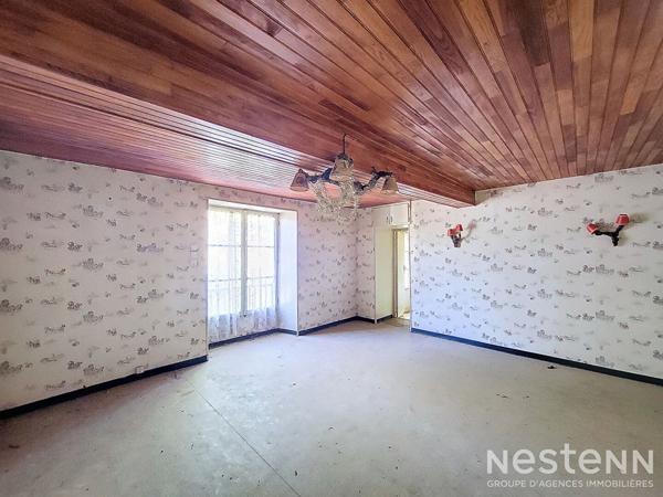 A Vendre Maison en pierre mitoyenne de 165 m² avec jardin proche du centre-ville