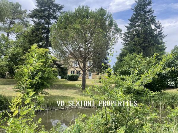 15 minutes de Saint-Emilion, belle maison pierre avec terrasse et  garage dans un magnifique parc arboré, agrémenté d'un  étang