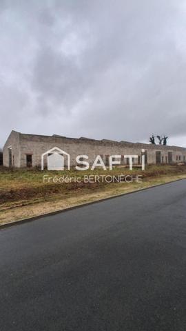 Bâtiment industriel non fini implanté dans une zone industrielle dynamique.