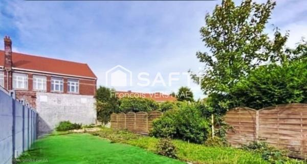 maison atypique de 125 m2 avec garage attenant , grand hangar  et jardin