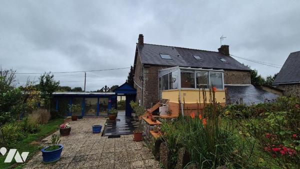 Proche de Gorron, maison en pierres comprenant :

Rez-de-jardin : véranda, cuisine aménagée a...