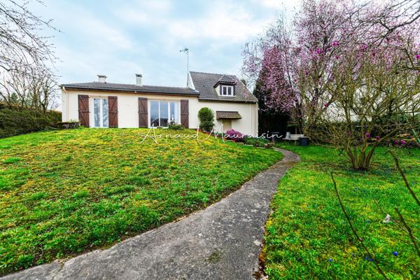 Maison bien entretenue avec joli jardin