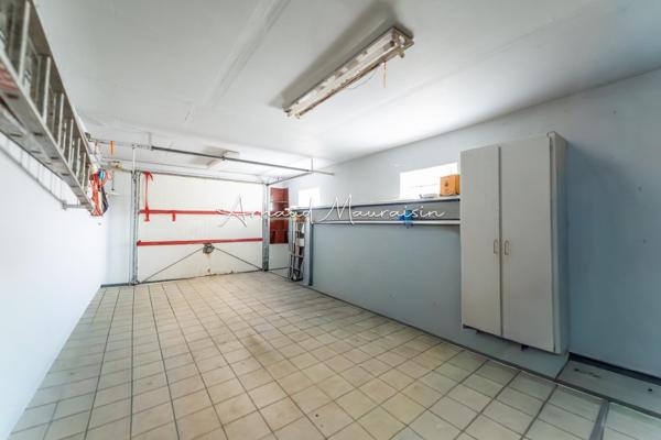 Maison bien entretenue avec joli jardin
