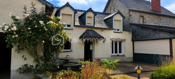 A seulement 13 minutes de Mayenne, en campagne, venez découvrir cette charmante maison en pierre de 150 m2, implantée sur un terrain clos et arboré de 9420 m2.

Elle offre une cuisine aménagée et équipée avec cheminée ouverte, un salon/séjour, une véranda chauffée par le sol avec cheminée, une arrière-cuisine, une salle d'eau, un WC, une cave, un garage avec grenier et un local chaufferie.

A l'étage, vous trouverez trois chambres, un bureau (ou chambre d'appoint), une salle d'eau et deux WC.

Côté prestation : pompe à chaleur, aspirateur centralisé, portail électrique, atelier garage, bergerie, poulailler et puits.

Une propriété idéale pour une famille, d'espace et de nature, tout en restant proche de Mayenne.

A visiter sans tarder !