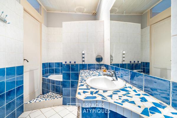 Appartement ancien en plein centre avec jardin, caves et grenier