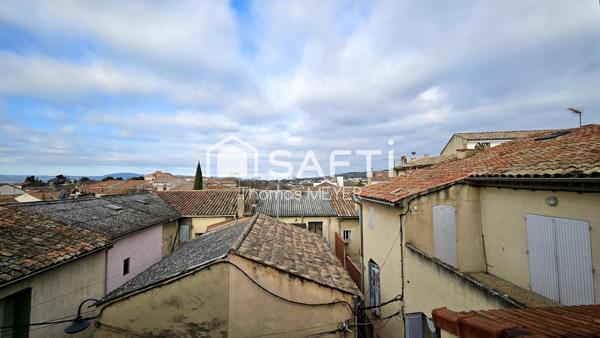 immeuble d'environ 140m² avec local commercial