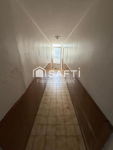 IMMEUBLE DE RAPPORT AVEC 3 LOGEMENTS ET UN JARDIN