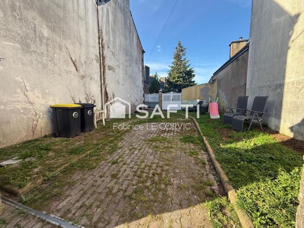 IMMEUBLE DE RAPPORT AVEC 3 LOGEMENTS ET UN JARDIN