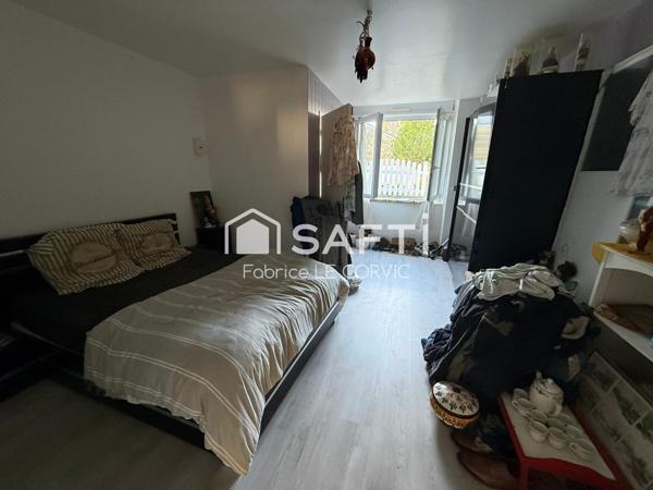 IMMEUBLE DE RAPPORT AVEC 3 LOGEMENTS ET UN JARDIN