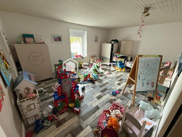 IMMEUBLE DE RAPPORT AVEC 3 LOGEMENTS ET UN JARDIN