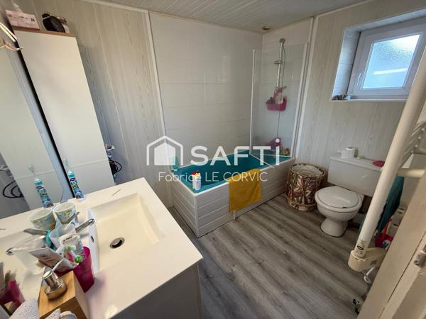 IMMEUBLE DE RAPPORT AVEC 3 LOGEMENTS ET UN JARDIN