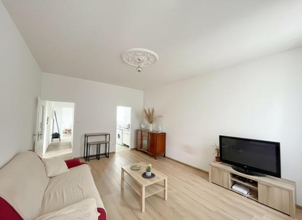 À découvrir : appartement lumineux de 50 m² avec cave et espace extérieur