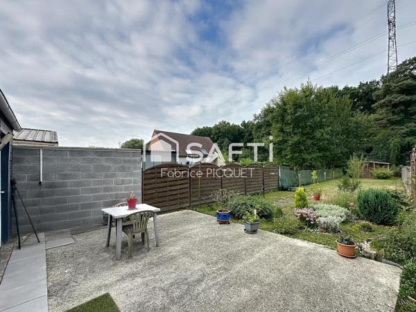 Maison semi individuelle à Raismes– Parcelle de 400 m²- véranda-  4 chambres