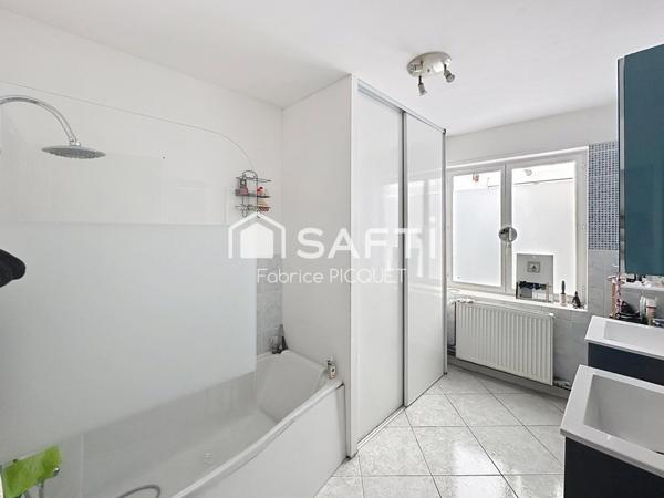 Maison semi individuelle à Raismes– Parcelle de 400 m²- véranda-  4 chambres
