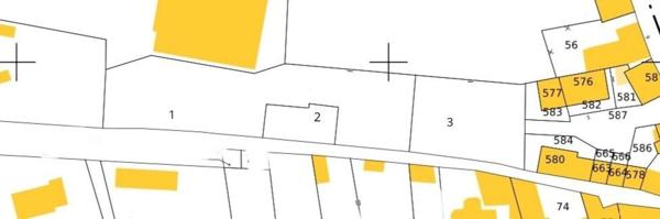 Terrain constructible de 2 238 m² au coeur du bourg.