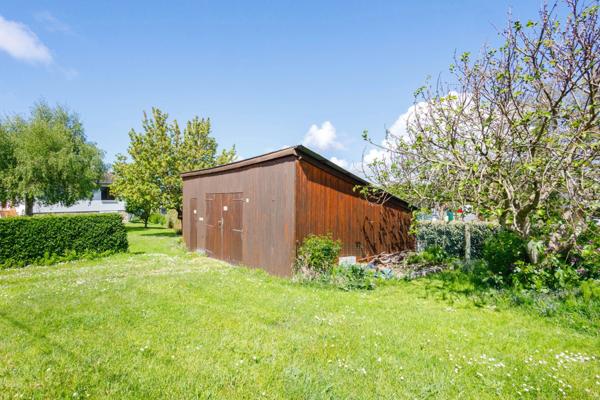 HONFLEUR - TERRAIN CONSTRUCTIBLE 702 m² AVEC GARAGE EXISTANT – LIBRE DE CONSTRUCTEUR