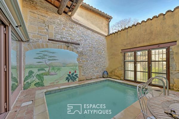 L’élégance d’un ancien chai: Volumes cathédrale et bassin romain