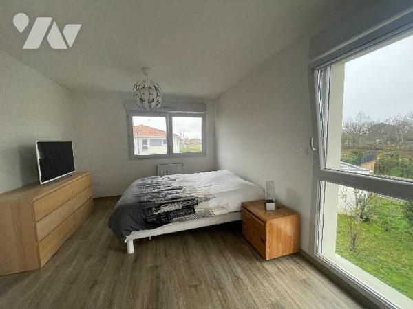 Appartement T3 en duplex avec jardin et 2 places de parking