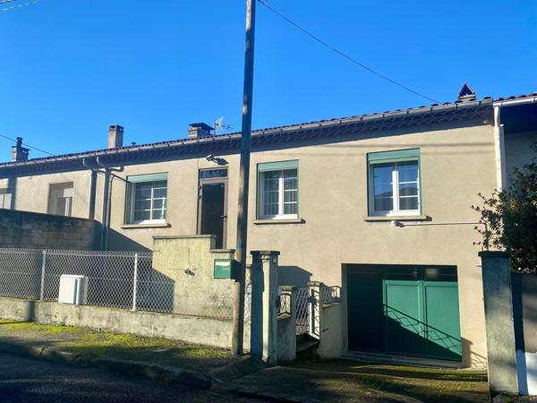 Maison de ville avec garage et jardin