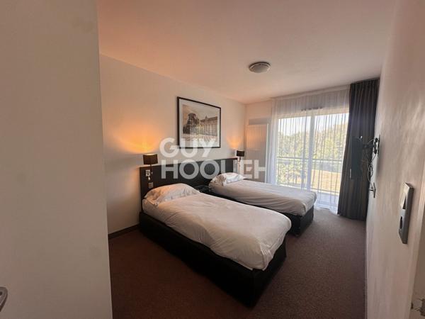 Investissement locatif sécurisé T2 de 50m2 meublé avec terrasse et services 4 étoiles