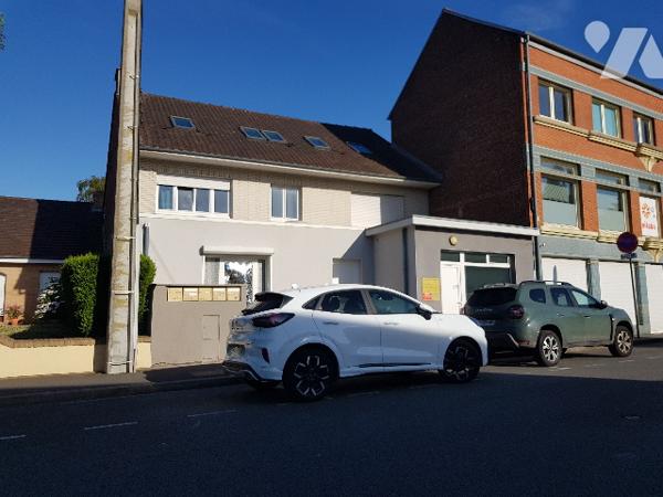 Immeuble de rapport de 4 logements et d'un local professionnel situé en centre ville.
