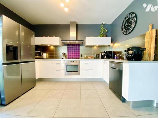 Maison de T4 avec jardin et place de stationnement privatives