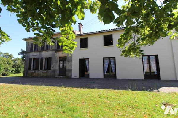 Ensemble immobilier en pierre de 1287m² de bâtiments sur 1ha3 de terres à 20 mns de SAINTES