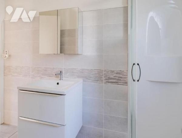 Maison de ville de 102 m² avec jardin, vendu avec locataire.