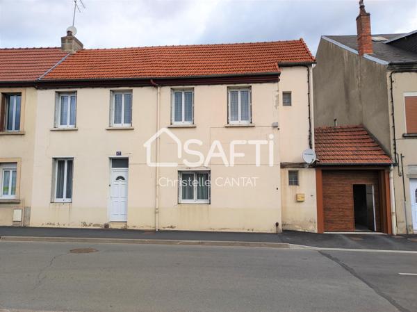 Maison composée de 2 logements F3, F4, terrain, garage.