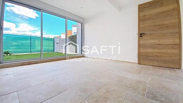 Appartement rénové - Rez-de-chaussée proche plage - 79 m², 2 suites, jardin et terrasse, 2 places de parking.