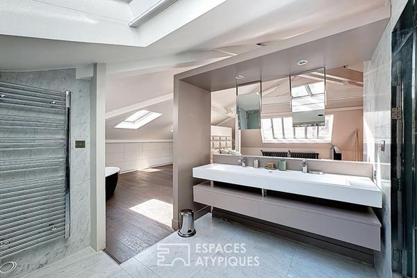 Duplex dernier étage esprit loft rénové par architecte proche Place des Victoires