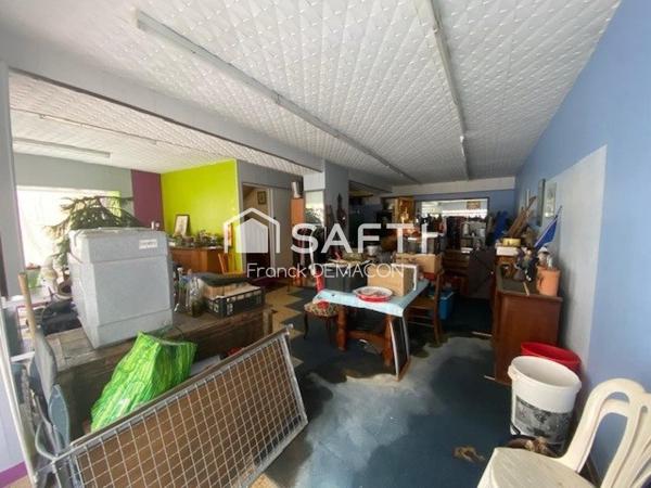 Immeuble de rapport avec local commercial et appartement – Centre-ville de Montmédy
