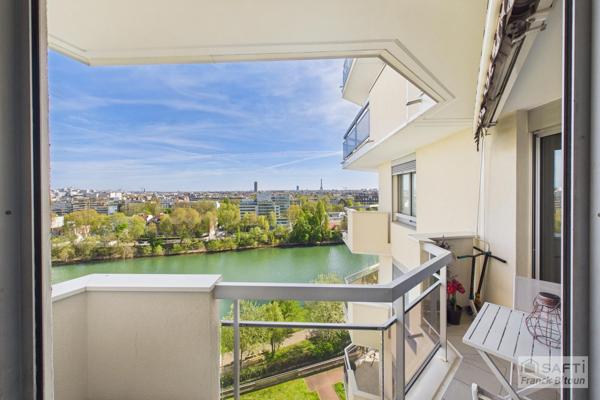 Vue SEINE, ÎLE DE LA JATTE et TOUR EIFFEL. Balcon, cave, et box en sus.