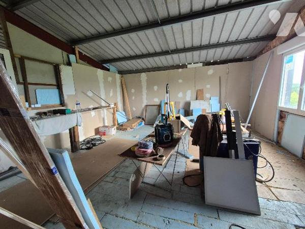 Bien mixte à usage de garage avec partie habitation en duplex et possibilité loft