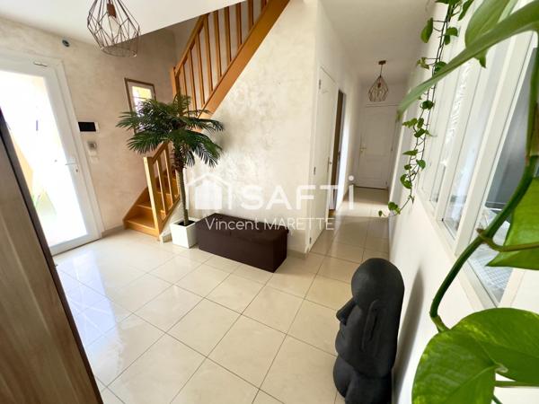 Maison familiale avec jardin, garage et confort moderne