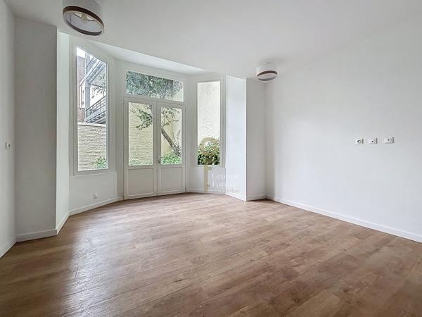 Appartement en RDC avec belle cour