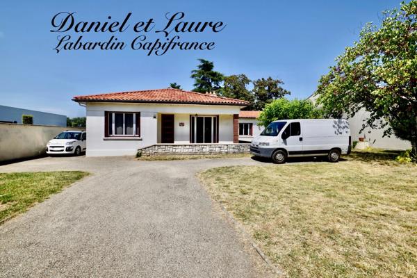 Maison de plain-pied - 4 chambres - garage - terrain clos