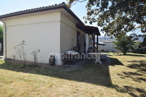 Maison de plain-pied - 4 chambres - garage - terrain clos