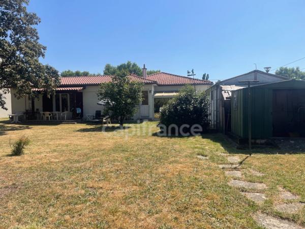 Maison de plain-pied - 4 chambres - garage - terrain clos