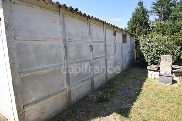 Maison de plain-pied - 4 chambres - garage - terrain clos