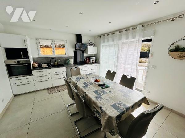 Rez de terrasse dans maison de 5 logements