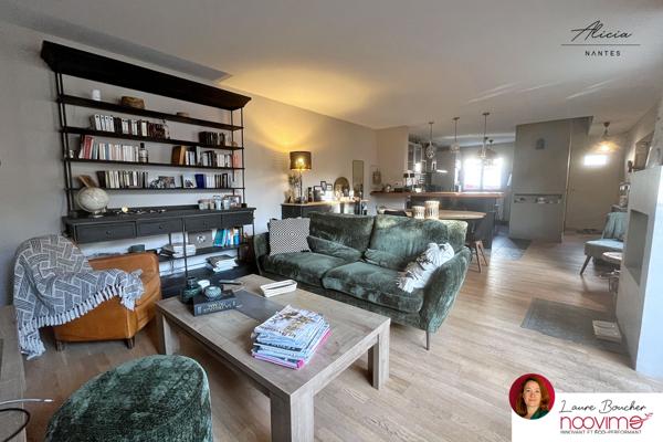 Maison familiale de 120 m² avec 4 chambres, jardin et garage.