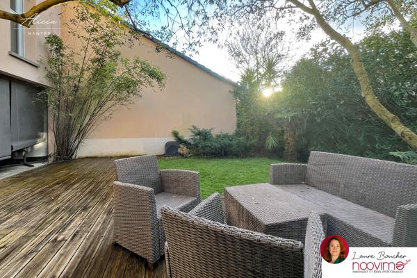 Maison familiale de 120 m² avec 4 chambres, jardin et garage.