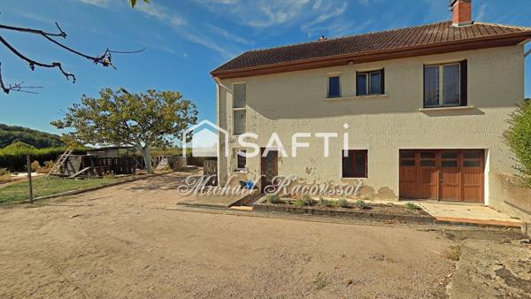 Maison de 100 m² à rénover – 3 chambres – Garages et jardin