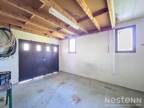 A Vendre Maison habitable de plain-pied avec trois chambres, un garage et un jardin clôturé