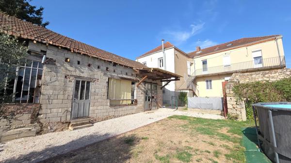 Immeuble de caractère en centre-ville : appartement rénové, local commercial et vaste potentiel à exploiter