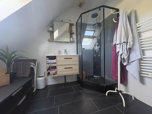 Maison située en bourg, à proximité d'Angers