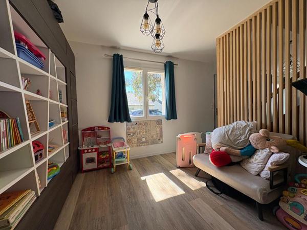 Maison située en bourg, à proximité d'Angers